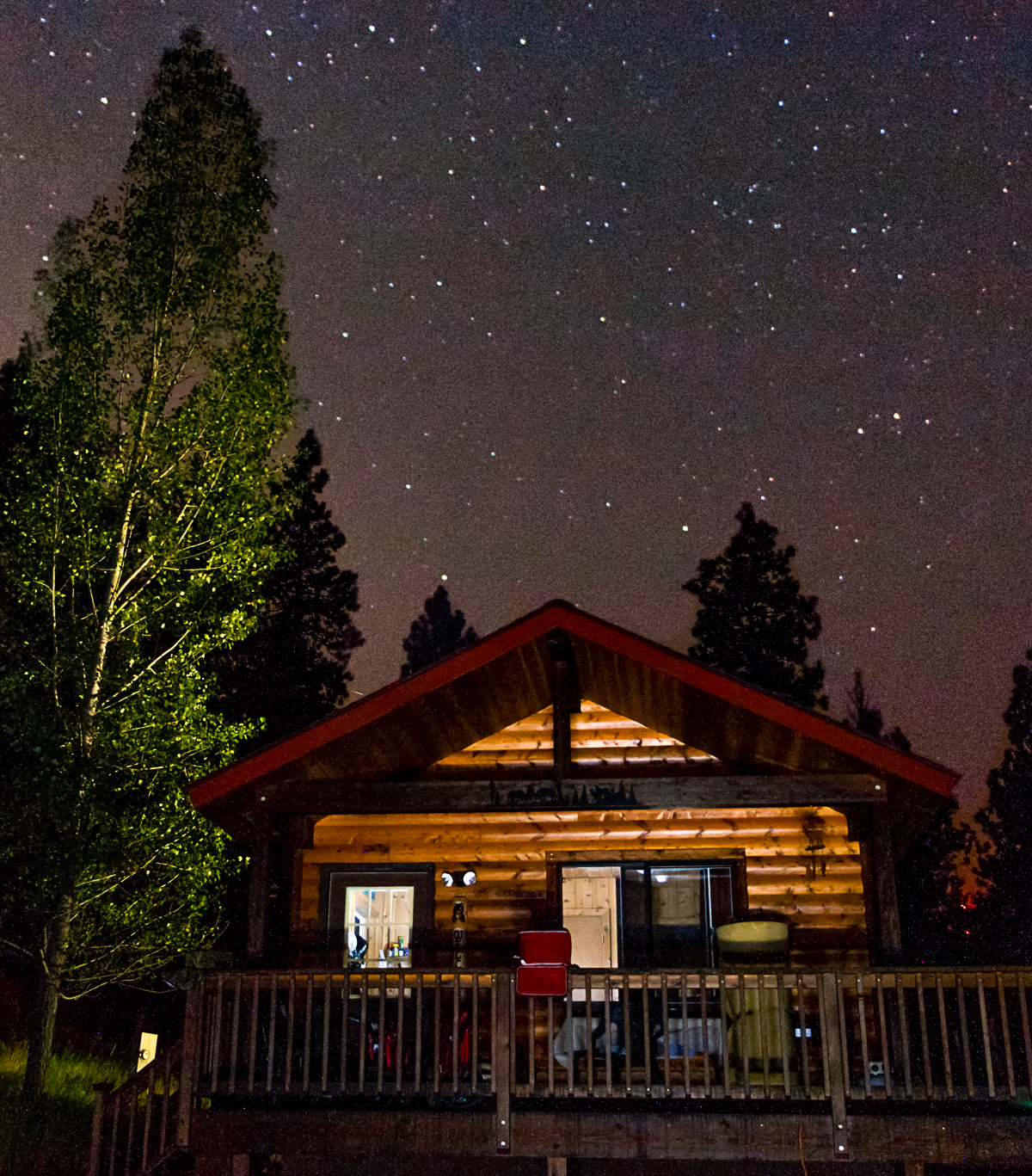 Photo of A Log Cabin at Night